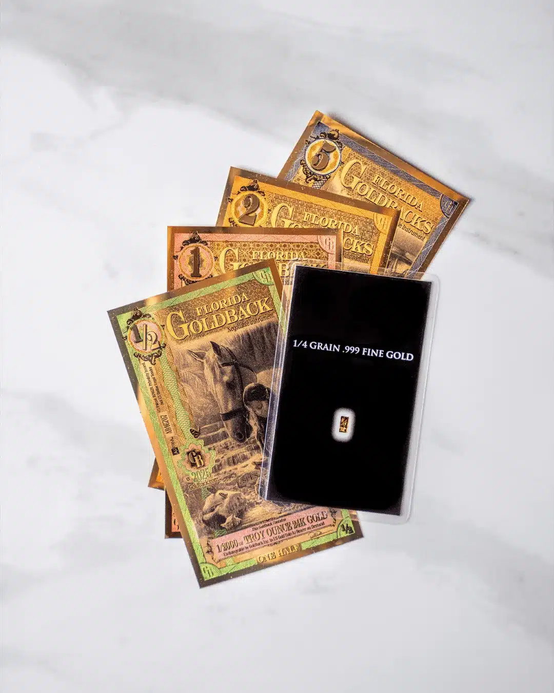 Fractional gold formats side by side, showing the difference in physical size